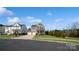 Two-story house with gray siding, stone accents, and a two-car garage at 1585 Whitman Ct, York, SC 29745