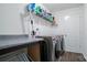 Convenient laundry room with washer, dryer, and shelving at 1585 Whitman Ct, York, SC 29745