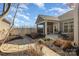 Landscaped backyard with stone pathway and screened porch at 1608 Traditions Ct, Waxhaw, NC 28173