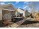 Landscaped backyard with stone pathway and pond view at 1608 Traditions Ct, Waxhaw, NC 28173