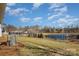 Backyard view with pond and community features at 1608 Traditions Ct, Waxhaw, NC 28173