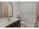 Bathroom with vanity, toilet, shower, and updated fixtures at 1608 Traditions Ct, Waxhaw, NC 28173