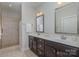 Double vanity bathroom with walk-in shower at 1608 Traditions Ct, Waxhaw, NC 28173