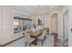 Bright dining room featuring a wooden table and access to backyard at 1608 Traditions Ct, Waxhaw, NC 28173