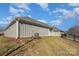 Tan house exterior with a grassy yard and a black fence at 1608 Traditions Ct, Waxhaw, NC 28173