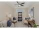 Home office with built-in shelving and hardwood floors at 1608 Traditions Ct, Waxhaw, NC 28173