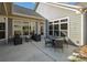 Relaxing patio with seating area and view of backyard at 1608 Traditions Ct, Waxhaw, NC 28173