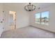 Bright bedroom with chandelier and two windows at 18038 Greyfield Gln, Fort Mill, SC 29707