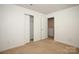 Bright bedroom with neutral carpeting and spacious closet at 1812 Hooper Ct, Charlotte, NC 28212