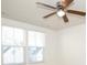 Bedroom with ceiling fan and two large windows at 1812 Hooper Ct, Charlotte, NC 28212