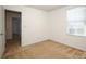 Well-lit bedroom featuring neutral walls and carpet at 1812 Hooper Ct, Charlotte, NC 28212