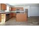 Kitchen with island, stainless steel appliances, and wood cabinets at 1812 Hooper Ct, Charlotte, NC 28212