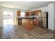 Kitchen with island, stainless steel appliances, and wood cabinets at 1812 Hooper Ct, Charlotte, NC 28212