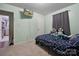 Comfortable bedroom with TV, plush carpet, and a calming ambiance at 1901 Ashcraft Ave, Monroe, NC 28110