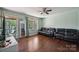 Cozy living room featuring hardwood floors, comfortable seating, and plenty of natural light at 1901 Ashcraft Ave, Monroe, NC 28110