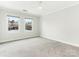 Bright bedroom with neutral walls and carpeting at 2031 Queens W Rd, Charlotte, NC 28207