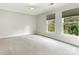 Bright bedroom with gray carpet and ceiling fan at 2031 Queens W Rd, Charlotte, NC 28207