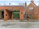 Brick carport with gated access and additional storage at 2031 Queens W Rd, Charlotte, NC 28207