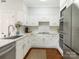 Modern kitchen with white cabinets, quartz countertops, and stainless steel appliances at 2031 Queens W Rd, Charlotte, NC 28207