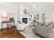 Spacious living room with fireplace, hardwood floors, and neutral decor at 2031 Queens W Rd, Charlotte, NC 28207