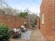 Cozy brick courtyard with seating area, perfect for relaxing outdoors at 2031 Queens W Rd, Charlotte, NC 28207