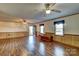 Spacious living room featuring hardwood floors and ceiling fans at 211 Roy Eaker Rd, Cherryville, NC 28021