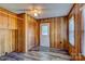 Sunroom with wood paneling, built-in storage, and window at 211 Roy Eaker Rd, Cherryville, NC 28021