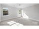 Well-lit bedroom featuring a ceiling fan and carpet at 2714 Selwyn Ave, Charlotte, NC 28209