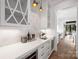 Butler's pantry with white cabinets, quartz countertops, and herringbone tile at 2714 Selwyn Ave, Charlotte, NC 28209