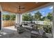 Relaxing covered patio with seating area, ceiling fan, and view of the backyard at 2714 Selwyn Ave, Charlotte, NC 28209