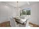 Formal dining room featuring a statement chandelier and hardwood floors at 2714 Selwyn Ave, Charlotte, NC 28209