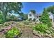 Landscaped front yard with lush greenery and hydrangeas at 2714 Selwyn Ave, Charlotte, NC 28209