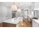 Gourmet kitchen boasts a large island, stainless steel appliances, and white cabinetry at 2714 Selwyn Ave, Charlotte, NC 28209