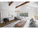 Spacious main bedroom with high ceilings, exposed beams, and large windows at 2714 Selwyn Ave, Charlotte, NC 28209