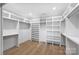 Large walk-in closet with ample shelving and hanging space at 2714 Selwyn Ave, Charlotte, NC 28209