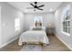 Bedroom with queen-size bed, side table and wood floor at 30 Walnut Nw Ave, Concord, NC 28027