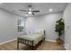 Cozy bedroom with a bed, plant, and wood floor at 30 Walnut Nw Ave, Concord, NC 28027