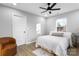 Bright bedroom with a queen bed, an armchair, and plenty of natural light at 30 Walnut Nw Ave, Concord, NC 28027