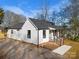 Side view of charming white house with gray roof at 30 Walnut Nw Ave, Concord, NC 28027