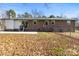 Home's rear elevation showcasing a patio and fenced yard at 322 Timber Rd, Iron Station, NC 28080