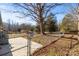 Fenced backyard with large tree and patio area at 322 Timber Rd, Iron Station, NC 28080