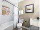 Updated bathroom with marble-look walls, a bathtub, and a modern vanity at 322 Timber Rd, Iron Station, NC 28080