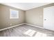 Spacious bedroom with a window and wood-look floors at 322 Timber Rd, Iron Station, NC 28080