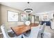 Elegant dining room with a wood table and gray chairs at 322 Timber Rd, Iron Station, NC 28080