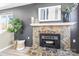 Stone fireplace with modern mantel and stylish decor at 322 Timber Rd, Iron Station, NC 28080