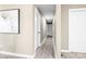 Bright hallway with wood-look floors and neutral walls at 322 Timber Rd, Iron Station, NC 28080