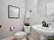 Clean powder room with white pedestal sink and rounded mirror at 3277 Richards Xing, Fort Mill, SC 29708