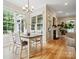 Open concept dining area with hardwood floors and access to the kitchen at 3277 Richards Xing, Fort Mill, SC 29708