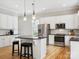 Modern kitchen with white cabinets, granite countertops, and island at 3277 Richards Xing, Fort Mill, SC 29708