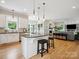 Modern kitchen with white cabinets, granite island, and stainless steel appliances at 3277 Richards Xing, Fort Mill, SC 29708